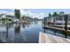 Scenic waterfront view featuring boat docks and a tranquil canal, perfect for boating enthusiasts at 300 Westwinds Dr, Palm Harbor, FL 34683