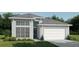 Inviting single-Gathering home with a manicured lawn, a two-car garage, and large windows that offer plenty of natural light at 306 Holly Bank Ave, Nokomis, FL 34275