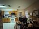 Functional kitchen with a microwave, oven, cabinets, tile floors, and a window that provides natural light at 3111 W Spruce St, Tampa, FL 33607