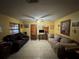 Comfortable living room featuring tile floors, fan, and plenty of seating at 3111 W Spruce St, Tampa, FL 33607
