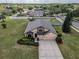 Aerial view of home featuring well-manicured lawn and landscaping in quiet neighborhood at 3303 Ranchdale Dr, Plant City, FL 33566