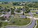 Aerial view of the home showcasing its large lot, fenced backyard, and neighborhood setting at 3303 Ranchdale Dr, Plant City, FL 33566