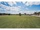Spacious fenced-in backyard with lush green grass, perfect for outdoor enjoyment at 3303 Ranchdale Dr, Plant City, FL 33566