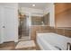 Spacious bathroom features shower, soaking tub, and elegant fixtures for a spa-like experience at 3303 Ranchdale Dr, Plant City, FL 33566
