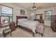 Comfortable bedroom with a bed, bench, ceiling fan and plenty of natural light at 3303 Ranchdale Dr, Plant City, FL 33566