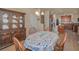 Charming dining area showcasing an ornate hutch and seamless flow into the kitchen at 3303 Ranchdale Dr, Plant City, FL 33566