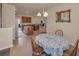 Cozy dining area with an adjacent kitchen featuring wood cabinets and stainless steel appliances at 3303 Ranchdale Dr, Plant City, FL 33566