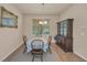Bright dining room features a classic wooden table set and a large window for natural light at 3303 Ranchdale Dr, Plant City, FL 33566