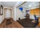 Inviting entryway leading into a home office featuring a unique wall decor at 3303 Ranchdale Dr, Plant City, FL 33566