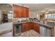 Modern kitchen featuring stone counter tops, wine cooler, and stainless steel appliances at 3303 Ranchdale Dr, Plant City, FL 33566