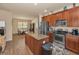 Open kitchen with an island, stainless steel appliances and adjoining dining area at 3303 Ranchdale Dr, Plant City, FL 33566