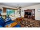 Comfortable living room featuring a plush sofa, large TV, and decorative rug at 3303 Ranchdale Dr, Plant City, FL 33566