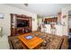 Spacious living room with entertainment center, bar seating and open floor plan at 3303 Ranchdale Dr, Plant City, FL 33566