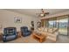 Comfortable living room with a sliding door that flows into an outdoor space, enhancing indoor-outdoor living at 3303 Ranchdale Dr, Plant City, FL 33566