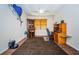 Functional home office with a desk, bookcase, and unique wall decor at 3303 Ranchdale Dr, Plant City, FL 33566