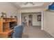 Another view of the office showing pillars, desk, and a view of the hallway at 3303 Ranchdale Dr, Plant City, FL 33566