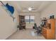 Functional office space with a ceiling fan and desk setup perfect for working from home at 3303 Ranchdale Dr, Plant City, FL 33566