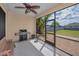 Screened patio featuring a grill, bench seating, and an open view of the backyard space at 3303 Ranchdale Dr, Plant City, FL 33566
