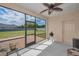 Enjoy the screened lanai with ceiling fan and view of the spacious backyard at 3303 Ranchdale Dr, Plant City, FL 33566
