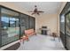 Covered patio featuring grill, bench seating, potted plants, and access to both the backyard and interior at 3303 Ranchdale Dr, Plant City, FL 33566