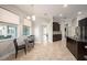 Bright kitchen area with dark cabinets, granite countertops, and view to the foyer and other living areas at 3417 Diamond Falls Cir, Land O Lakes, FL 34638