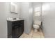Cozy bathroom features a standard toilet, vanity with sink, and a small window at 3553 34Th N Ave, St Petersburg, FL 33713