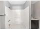 Bright bathroom featuring white tiled walls and tub with black vanity at 3553 34Th N Ave, St Petersburg, FL 33713