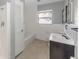 Bathroom with a tub and shower combination, vanity, toilet, and window at 3553 34Th N Ave, St Petersburg, FL 33713