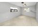Bright bedroom with neutral-colored walls, carpeted floor, and a ceiling fan at 3553 34Th N Ave, St Petersburg, FL 33713