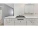 A clean kitchen area featuring white cabinets, countertop space, and a double basin sink at 3553 34Th N Ave, St Petersburg, FL 33713
