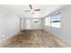 Open living room featuring light gray walls and bright natural light at 3553 34Th N Ave, St Petersburg, FL 33713
