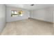 A spacious living room featuring neutral colors, tile flooring, and natural light at 3553 34Th N Ave, St Petersburg, FL 33713