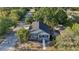 Aerial view of a charming home nestled among lush trees in a quiet neighborhood at 3902 E Henry Ave, Tampa, FL 33610