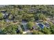 Aerial view of the neighborhood featuring tree lined streets and large backyards at 3902 E Henry Ave, Tampa, FL 33610