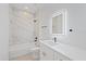 Bathroom featuring a vanity, a sleek mirror and a shower/tub combination with tile surround at 3902 E Henry Ave, Tampa, FL 33610
