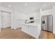 Bright kitchen with white cabinetry, stainless steel appliances, and a central island at 3902 E Henry Ave, Tampa, FL 33610
