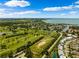 Breathtaking aerial view of a golf course, bay, and residential community at 3906 Versailles Dr, Tampa, FL 33634