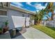 Backyard patio featuring outdoor fire pit, well manicured landscaping, and a serene view at 3906 Versailles Dr, Tampa, FL 33634