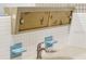 Retro bathroom sink with unique storage and vintage details add character and charm to the space at 3906 Versailles Dr, Tampa, FL 33634