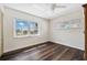 Bright bedroom features hardwood floors and natural light through a large window at 3906 Versailles Dr, Tampa, FL 33634