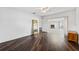 Spacious bedroom with dark wood floors and a view of the sunroom at 3906 Versailles Dr, Tampa, FL 33634
