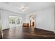 Bedroom featuring dark wood floors, with views of the sunroom and bathroom at 3906 Versailles Dr, Tampa, FL 33634