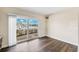 Bedroom featuring hardwood floors, a sliding glass door with a water view, and neutral walls at 3906 Versailles Dr, Tampa, FL 33634