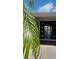 Home's entryway leading to waterfront with open doors and tiled flooring at 3906 Versailles Dr, Tampa, FL 33634