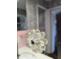 Close up of the hardware holding a glass shower door at 3906 Versailles Dr, Tampa, FL 33634