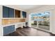 Home office featuring built in shelving and sliding glass door to water view at 3906 Versailles Dr, Tampa, FL 33634