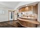 The kitchen boasts light-colored cabinetry, a breakfast bar, and access to the laundry room at 3906 Versailles Dr, Tampa, FL 33634