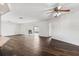 Large living area with dark wood floors and views of the fireplace at 3906 Versailles Dr, Tampa, FL 33634