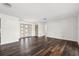 Open living area with wood flooring, bright white walls, and modern entranceway at 3906 Versailles Dr, Tampa, FL 33634