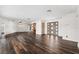Large living room with hardwood floors and an open floor plan is ideal for entertaining guests at 3906 Versailles Dr, Tampa, FL 33634